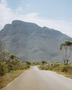 Narrow road leading to a mountain