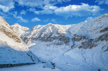 Stunning view of Fagaras mountains in winter. The ridge of the mountain full of snow. There are one of the beautiful road in the world, Transfagarasan