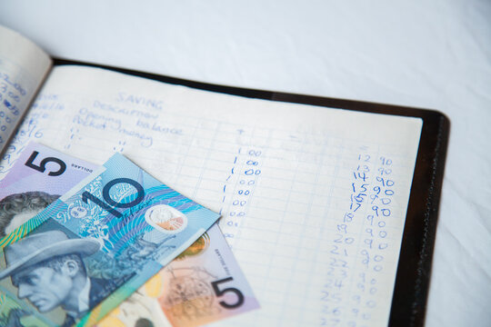 Australian dollar notes on childs budget ledger