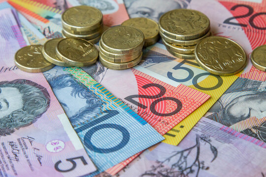 Australian coins sitting on notes