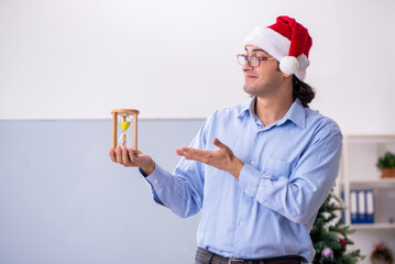 Young male teacher celebrating new year at school