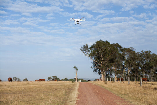 Remotely piloted aircraft flying over farm driveway