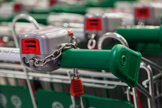 Coin insert slit on shopping trolley at supermarket