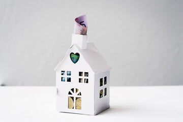 mini house with australian money, concept for real estate, banking, insurance, investment