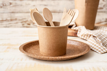 Eco tableware on table in kitchen