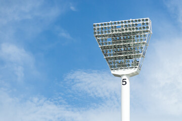 An MCG  lighting tower set against a blue sky