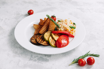 Risotto with baked vegetables: eggplant, zucchini, bell pepper, potatoes