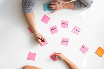 Planning a marketing strategy from above on sticky notes