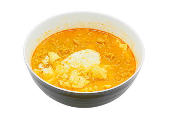 Egg and pork and chicken soup with noodles and vegetables in white bowl