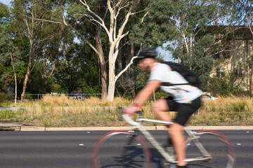 Blurred image of a cyclist commuting to work
