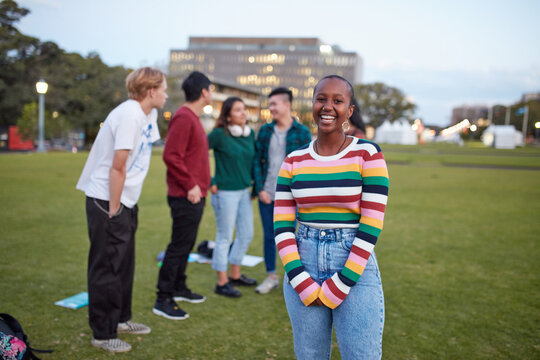 Group of young university students hanging out on-campus
