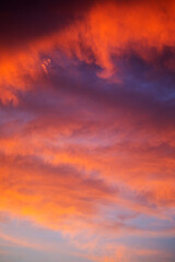 Skyscape at dusk with deep orange coloured clouds