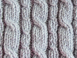 Handmade wool scarf close-up. Beautiful background.