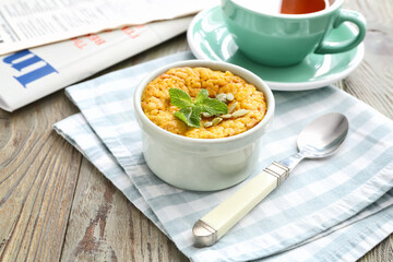 Tasty pumpkin pudding on table