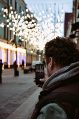 Funny fat man on the street with a phone.