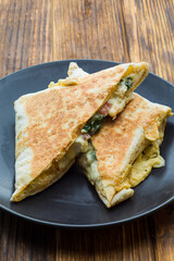 Healthy modern italian style snack on black plate