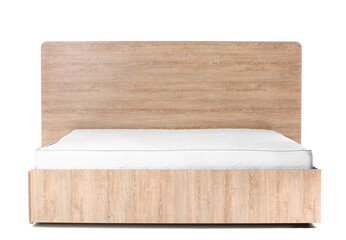 Bed with modern orthopedic mattress on white background