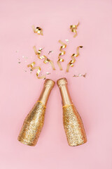 Sparkling wine, gold champagne bottle with glitter. © Diana Vyshniakova