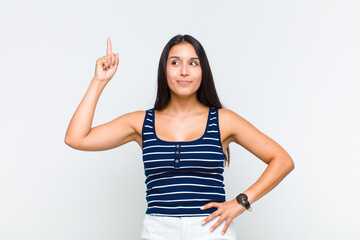 young woman feeling like a genius holding finger proudly up in the air after realizing a great...