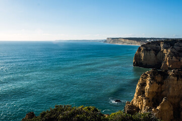 Rocky coastline with turquoise ocean in Lagos, Portugal