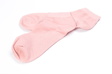 Pair of pink short socks on white background, top view