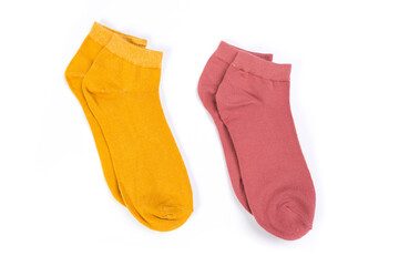 two pairs of colored short socks on a white background, top view