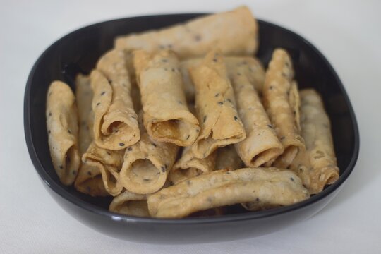 Rice flour cannoli, a popular fried snack from Kerala with rice and cocunut. 