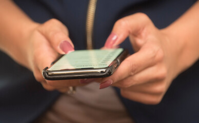 woman holding a smartphone in her hand