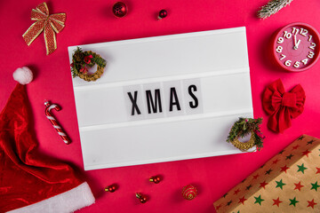 Xmas word on lightbox on Christmas decorated bacground Christmas and New Year's Eve, Christmas vacations, gifts concept