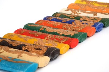 Coloured sticks of Chinese ink isolated on a white background
