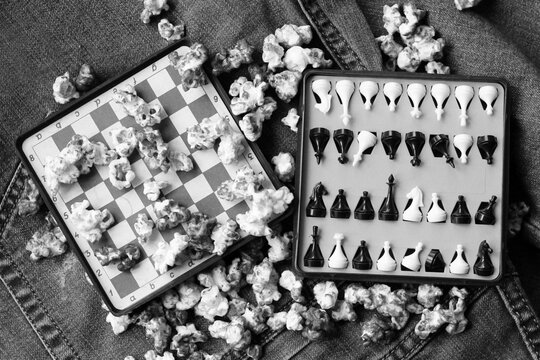 The little travel chess and popcorn, black and white image