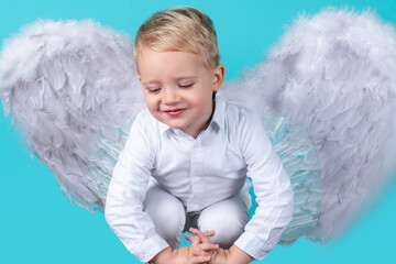 Angel children girl with white wings, isolated.