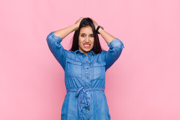 young woman feeling frustrated and annoyed, sick and tired of failure, fed-up with dull, boring...