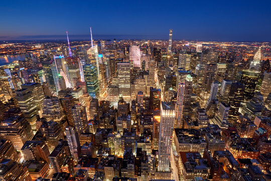Aerial evening view of Midtown New York City skyline along Fifth Avenue. Illuminated Manhattan skyscrapers, NYC.USA