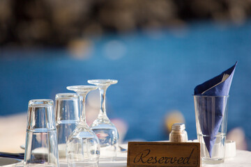 Reserved table in front of the aegean sea