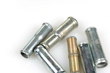 short size metal tubes on white background