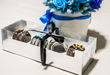 Set of chocolate bombs in giftbox with mini marshmallows, white chocolate, milk chocolate, hot...