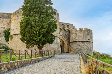 Access road to the main gate of the fortress of milazzo. milazzo. Sicily Italy. - 394760098