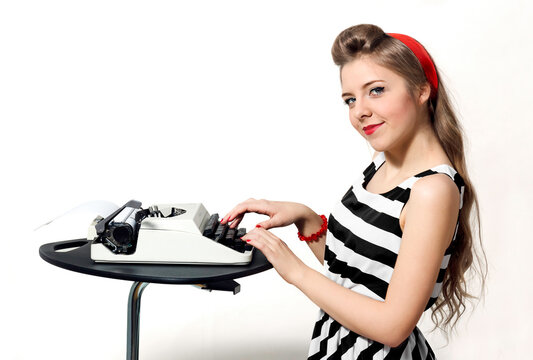 Pin-up girl typing on a typewriter. Typing machine. Retro style. Pin-up style. Red bow.