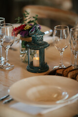 table setting with lantern and wineglasses