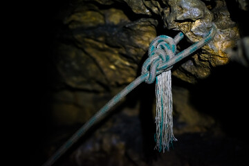 Attaching a climbing rope in a cave