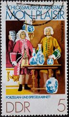 GERMANY, DDR - CIRCA 1974 : a postage stamp from Germany, GDR showing a porcelain and mirror cabinet. Arnstadt Castle Museum, Puppenstadt: Mon plaisir