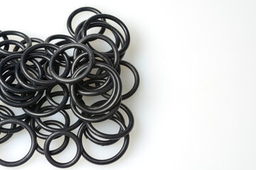 several sealing rings of different sizes in black close-up