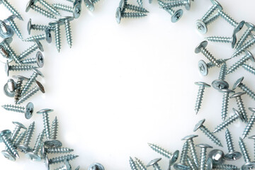 abstract background of metal screws on white background