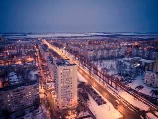 Aerial city winter view with crossroads and roads, houses, buildings, parks. Helicopter drone shot. Wide Panoramic image. Kharkiv, Ukraine