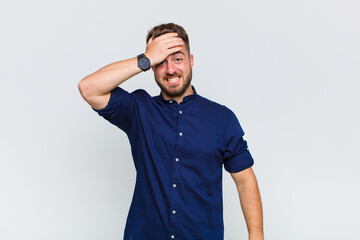 young man panicking over a forgotten deadline, feeling stressed, having to cover up a mess or...