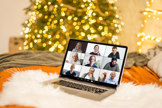 Christmas day Virtual meeting team teleworking. Family video call remote conference. Laptop webcam screen view. Diverse portrait headshots meet working from their home offices. Happy hour party online