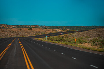 Fototapeta premium Natural american landscape with asphalt road to horizon.
