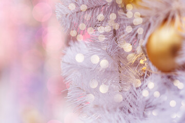 Christmas background of Golden balloons and garlands, on a pink background, blur. The concept of greeting cards for New year, Christmas and thanksgiving. Horizontal format, shallow depth of field