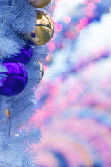 Christmas background of balloons and garlands, blue, bokeh. The concept of greeting cards for New year, Christmas and thanksgiving. Vertical format, shallow depth of field